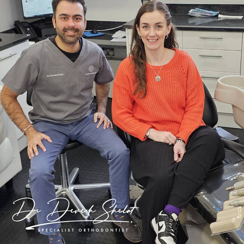 Dr Devesh Shelat with a real patient after orthodontic treatment