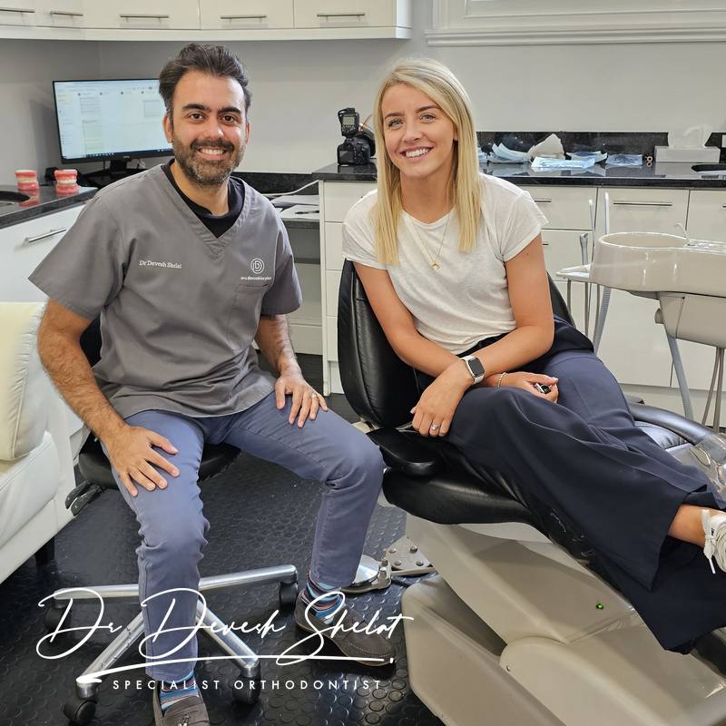 Dr Devesh Shelat with a real adult patient at the end of their treatment